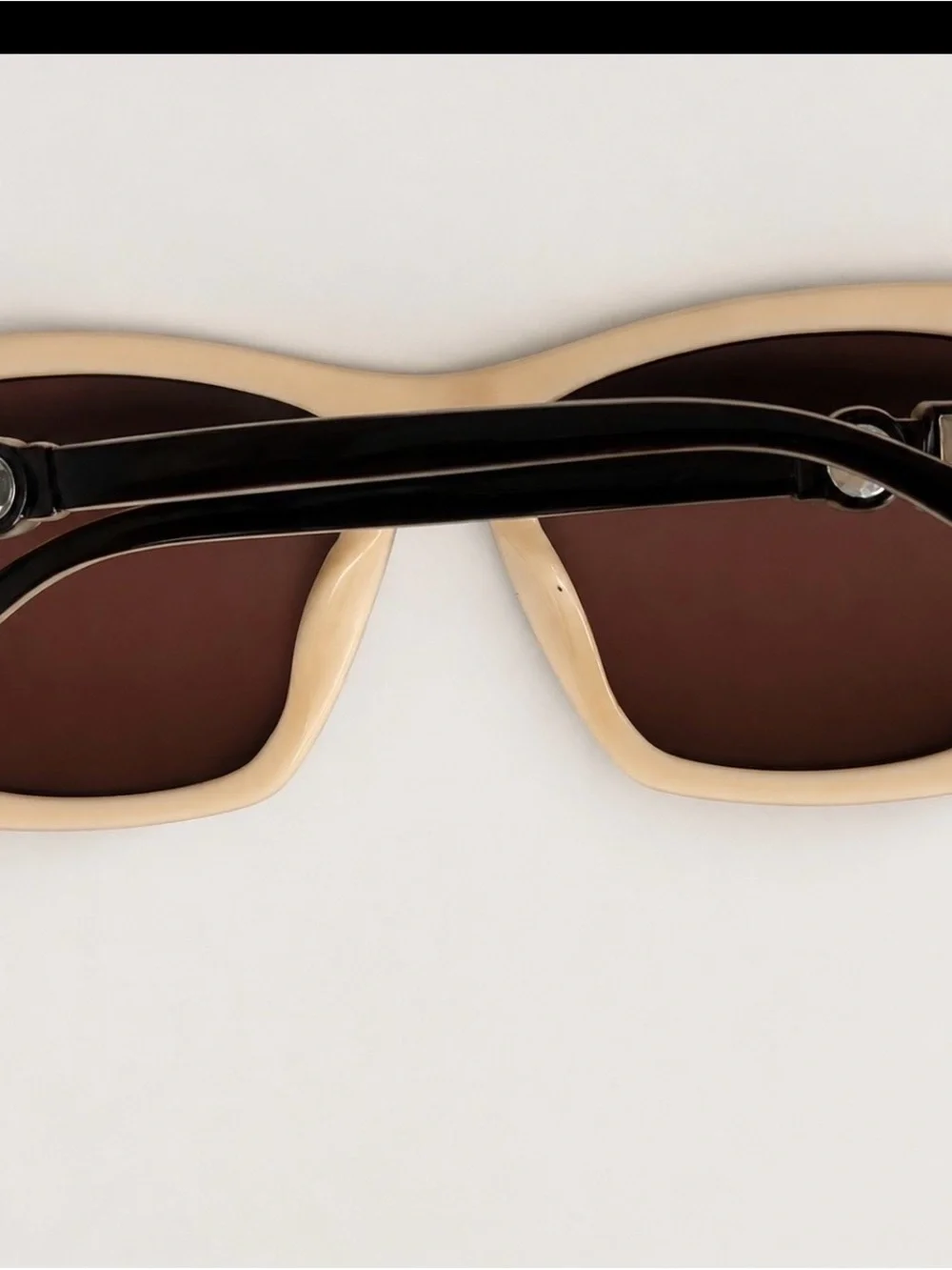 CHANEL Cream Frame Sunglasses with Crystal Accent and Black Trim